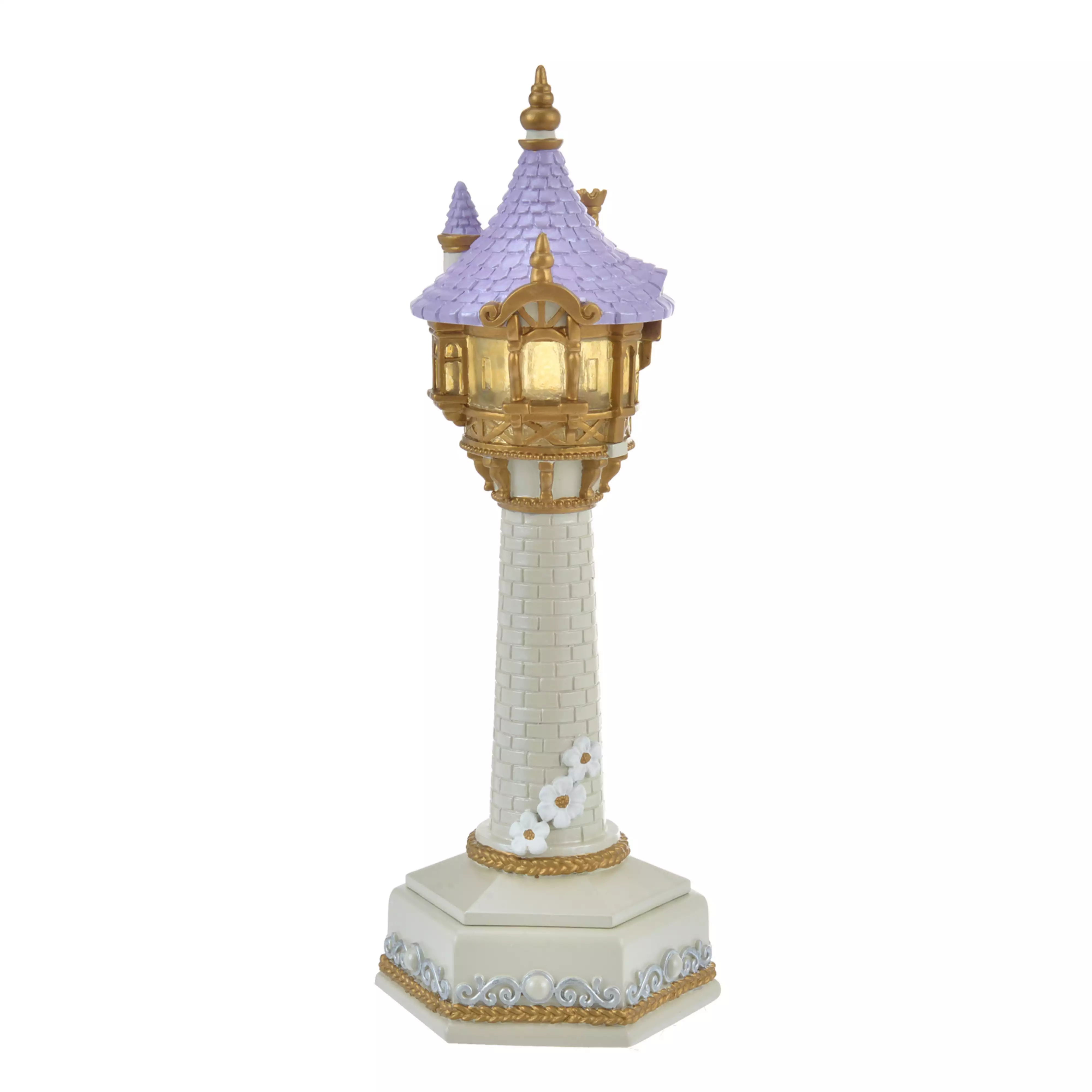 A Rapunzel tower-shaped LED desk lamp with a purple roof, gold turret, white brick column, and decorative hexagonal base.