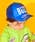 Child wearing a blue Disney Toy Story mesh baseball cap.