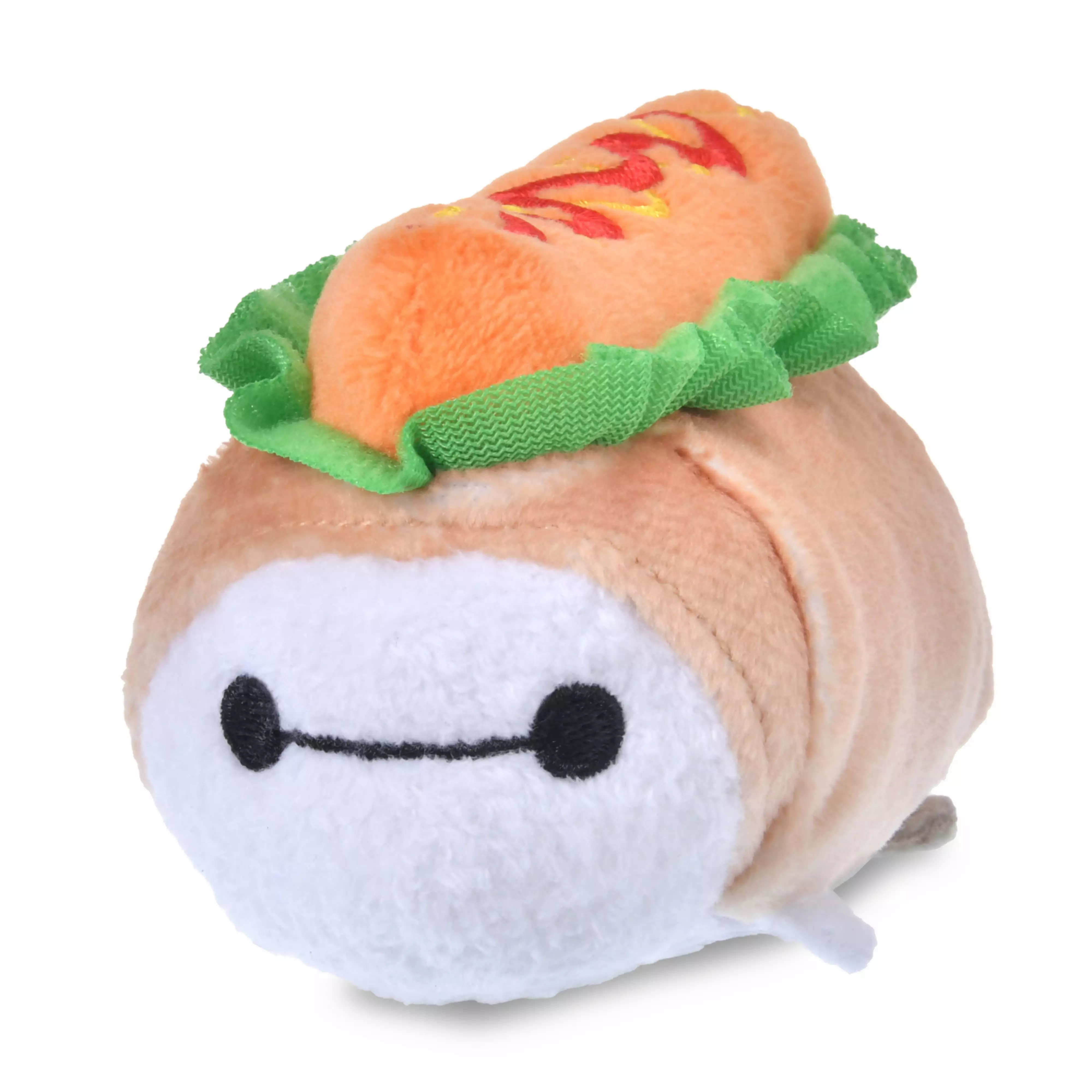 A small Baymax Tsum Tsum plush toy dressed as a hot dog with mustard and lettuce details.