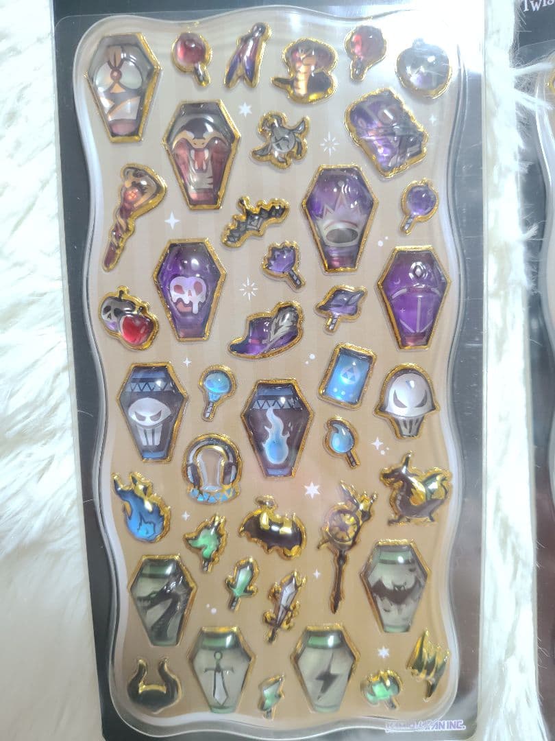 Packaged Twisted Wonderland paper sticker sheet showing glossy puffy coffin-shaped and accessory stickers.
