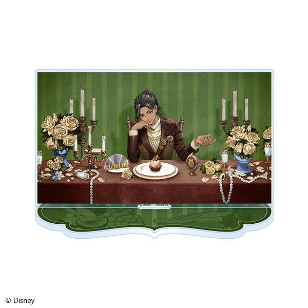 A rectangular acrylic stand showing Jamil Viper seated at a decorated table with candles, flowers, and a shaped base.