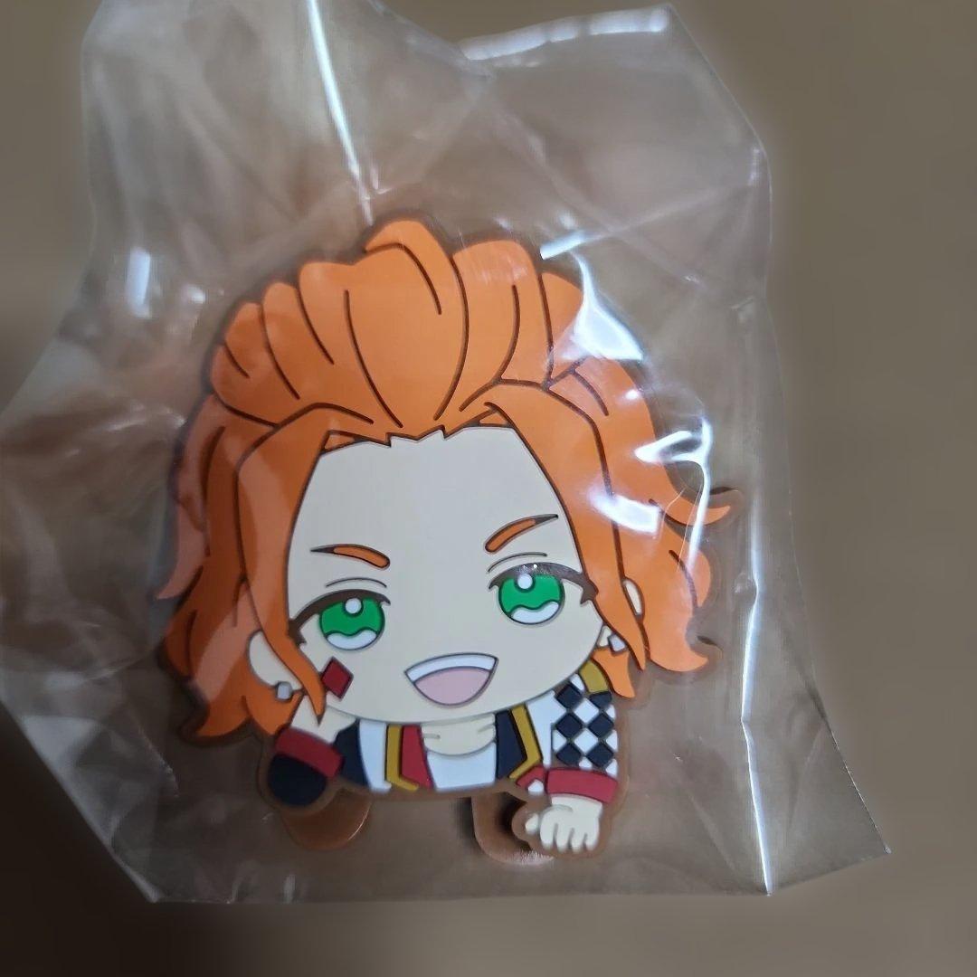 Front view of a Kate rubber hair clip showing a chibi orange-haired character inside a clear plastic bag.