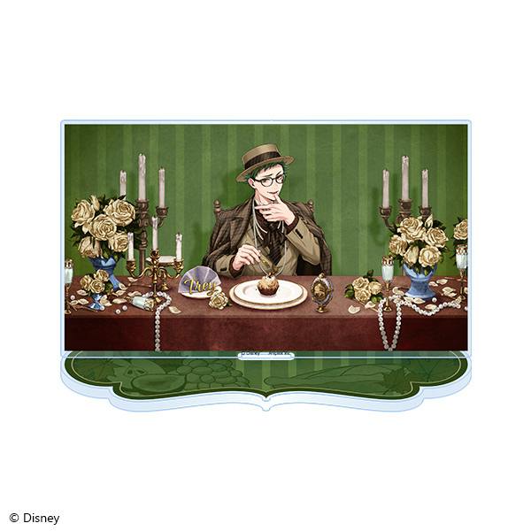 An acrylic stand of Trey Clover seated at a decorated table with a green-striped background.