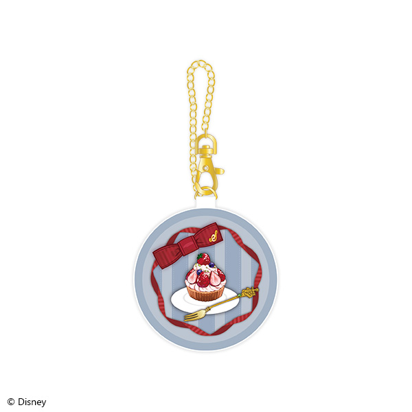 Round silver window pouch with a gold chain and a cupcake illustration inside, from Disney Twisted Wonderland.