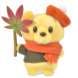 A Pooh plush (Momiji Pooh) holding a flower and wearing a red shirt.