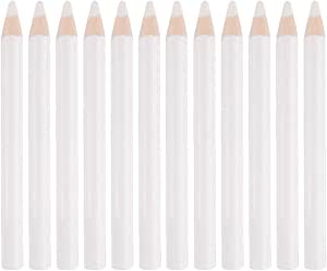 White wooden wax dotting pencils for nail art and crafting arranged in a row.