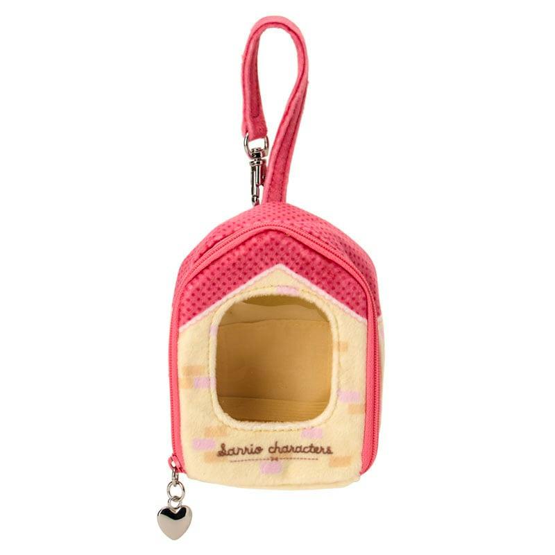 Front view of a small pink plush doll case keychain shaped like a house with a strap and a silver heart charm, showing its front opening and interior.