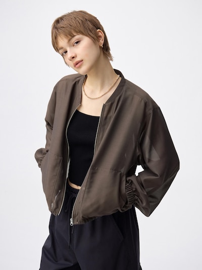 Model wearing the men's polyester dolman-sleeve jacket, front view with the jacket zipped.