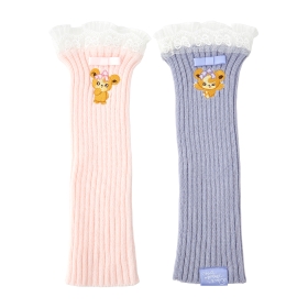 A pair of ribbed acrylic arm covers — one pale pink and one light lavender — each with white lace trim and a small bear character applique.