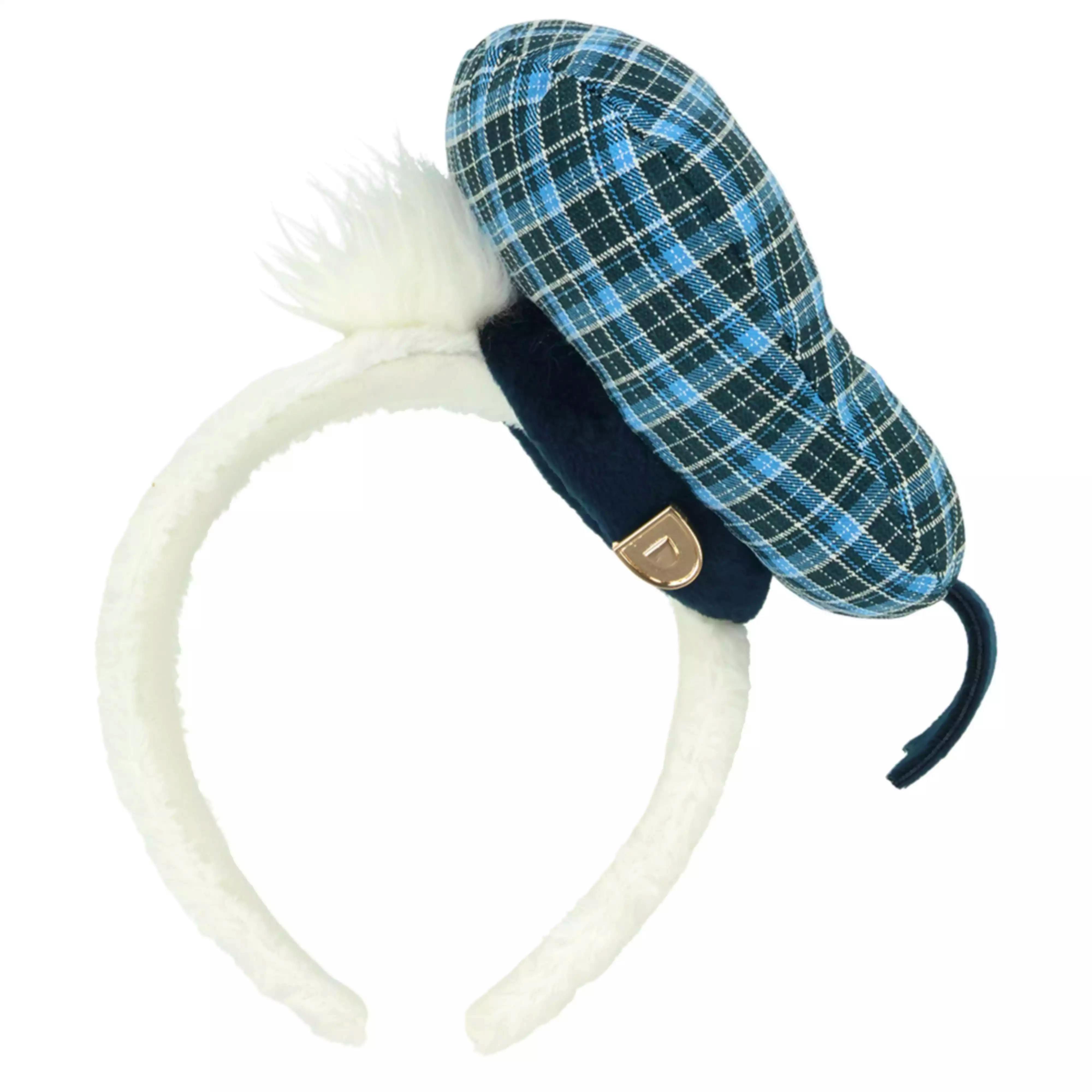 Close-up of the Donald headband showing a blue plaid cap, white faux-fur ear pieces, and a small gold "D" detail.