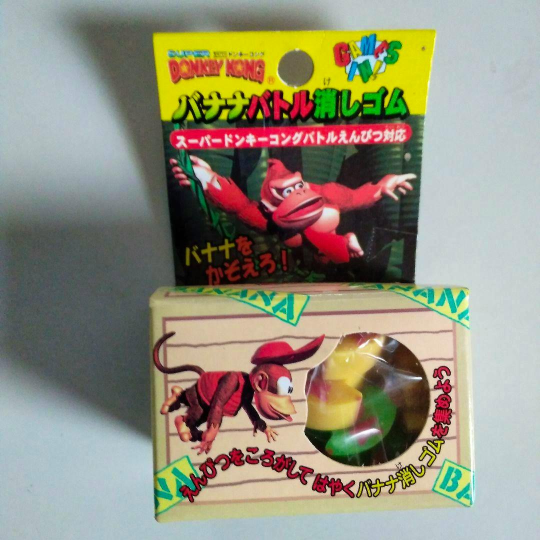 Boxed Donkey Kong "Banana Battle" eraser packaging with Donkey Kong artwork and banana-shaped erasers visible through a window.