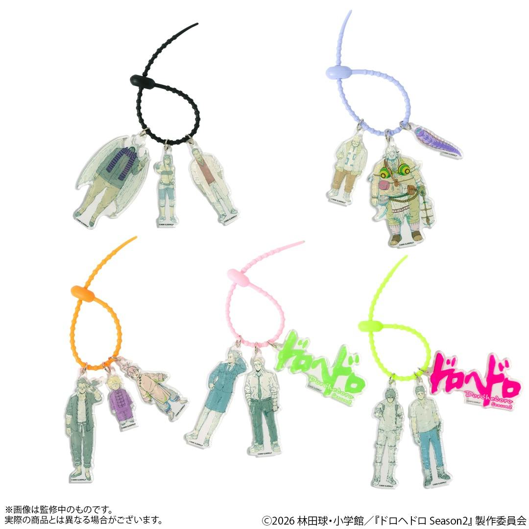 Multiple acrylic three-character Dorohedoro keychains displayed on various colored loop straps against a white background.