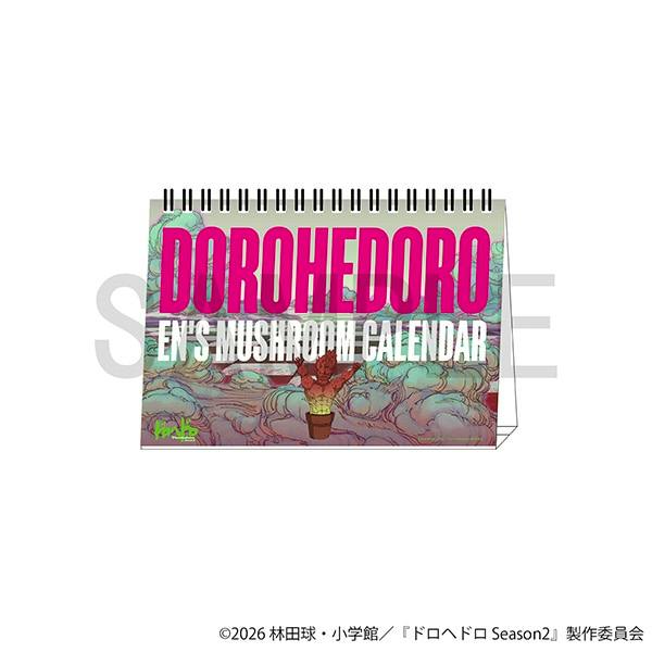 Spiral-bound tent-style desk calendar showing DOROHEDORO cover art and the text "EN'S MUSHROOM CALENDAR".