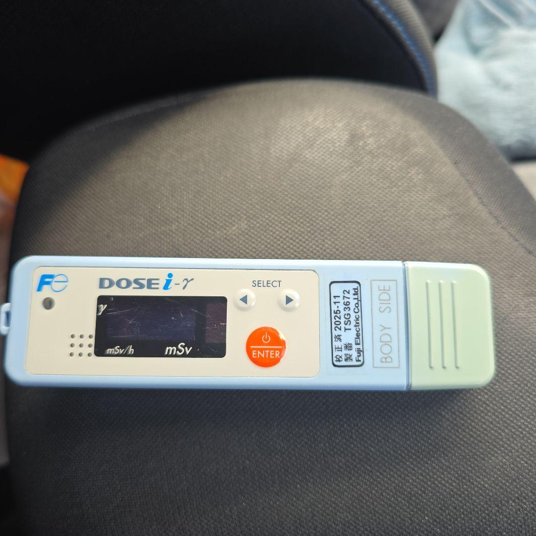 Front view of the DOSE i radiation detector MPD-2011-03 showing its display screen, Select and Enter buttons, and labeling.