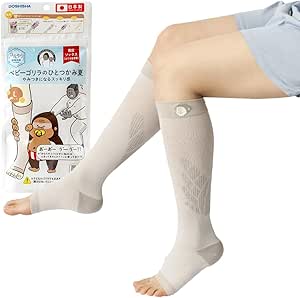 A seated model wears the Doshisha Baby Gorilla one-grip summer compression knee-high socks with the product packaging visible at left.