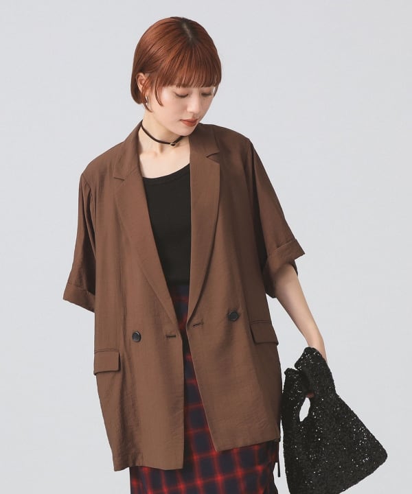 Model wearing a brown double-breasted half-sleeve women's rayon jacket.