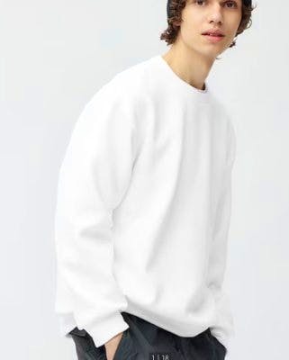 Model wearing a white long-sleeve double-face pullover shown from the hips up.