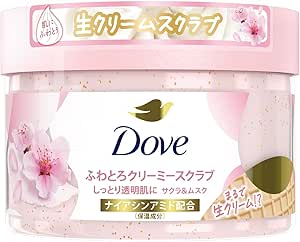 A pink jar of Dove Sakura & Musk creamy body scrub with cherry blossom graphics and the Dove logo on the label.