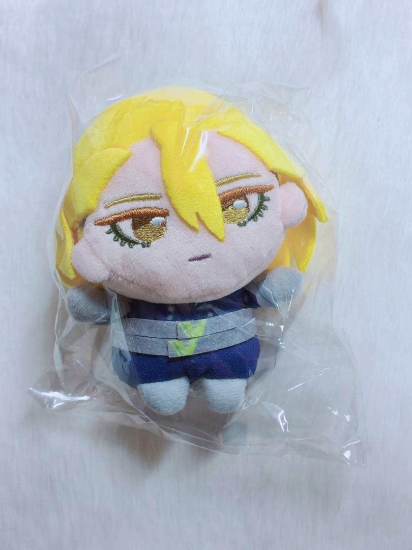 Front view of the Dr.STONE "Stanley" plush toy with yellow hair inside clear plastic packaging.