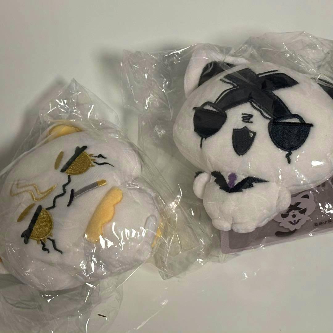 Two Dr.STONE ゼノ スタンリー plush toys shown in plastic packaging on a white surface.