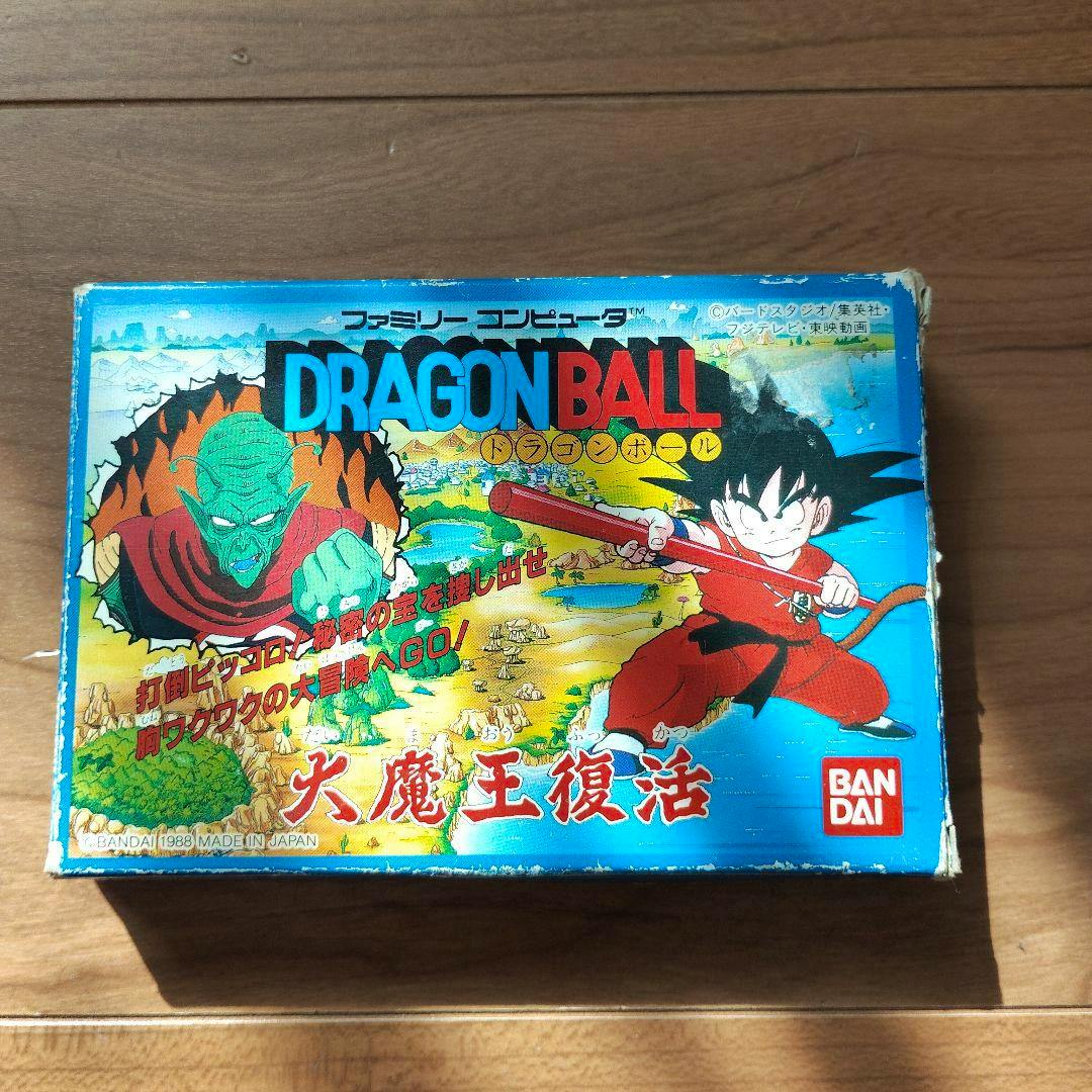 Front of the Famicom game box for "Dragon Ball 大魔王復活" showing the cover artwork and the Bandai logo.