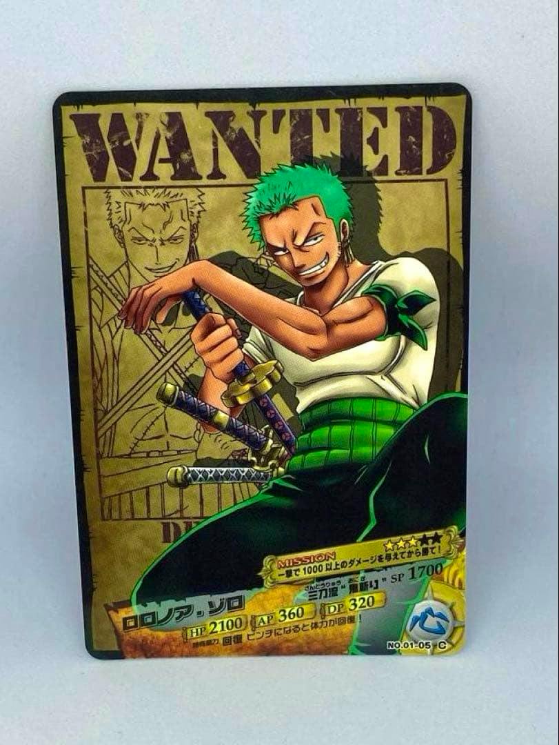 Front of an AR Carddass collectible card showing Roronoa Zoro illustration with a "WANTED" header and printed game stats.