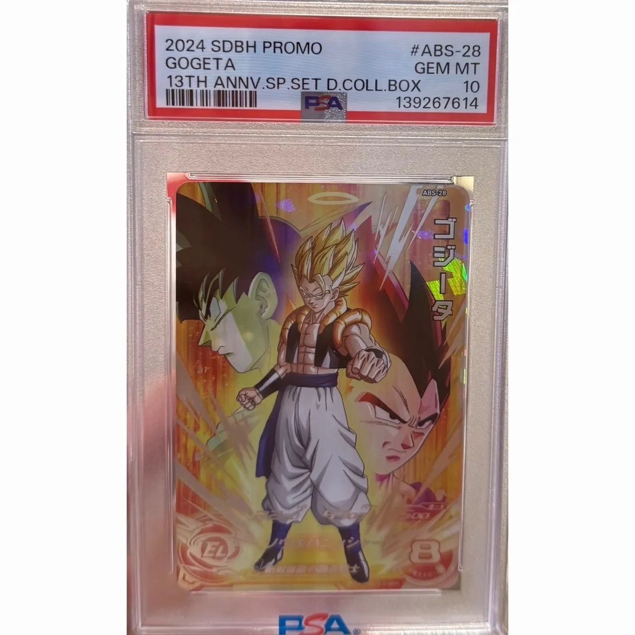 PSA-graded trading card (ABS-28) featuring Gogeta in a clear PSA slab with the label showing GEM MT 10.