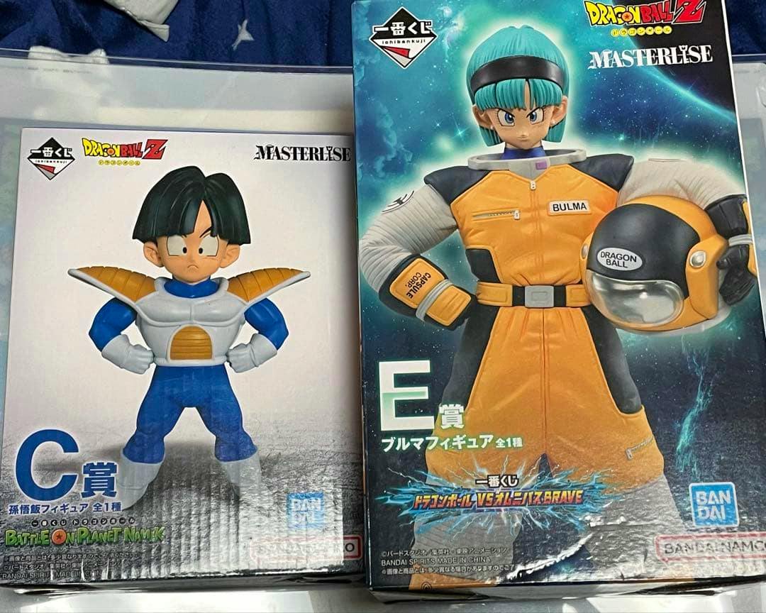 Two boxed Dragon Ball Z Ichiban Kuji figure boxes showing Gohan (C prize) and Bulma (E prize).