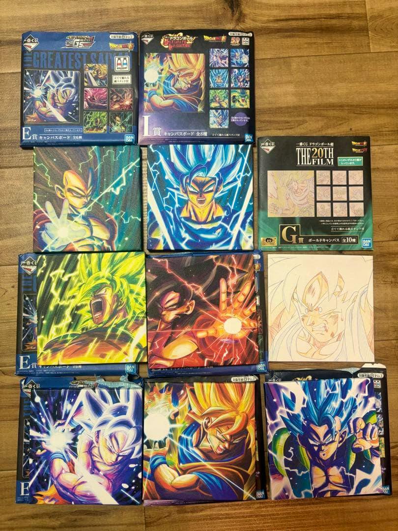 Photo showing Dragon Ball Ichiban Kuji canvas boards and their boxes arranged on a wooden surface.