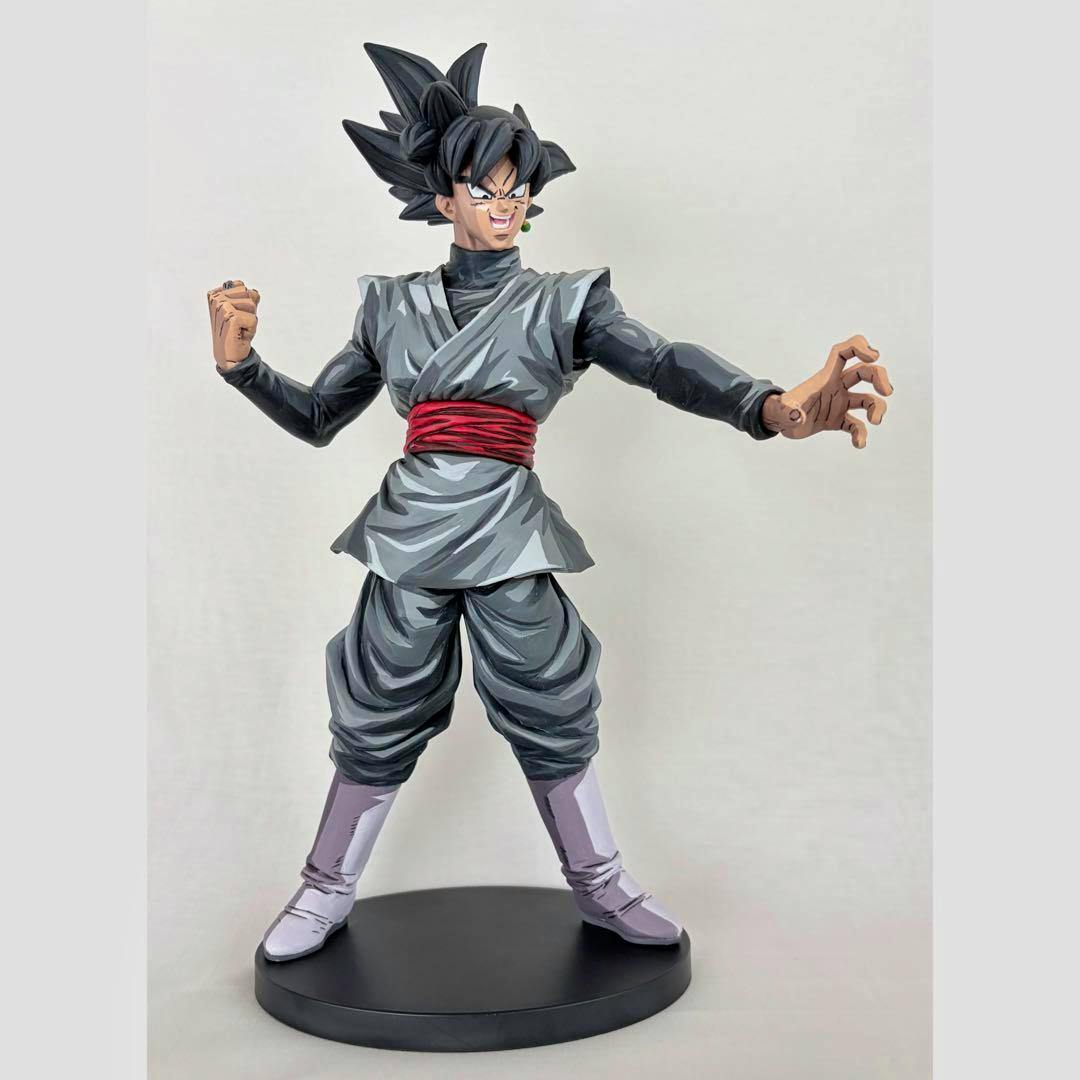 Front view of the repainted Goku Black plastic figure with two-dimensional style paint standing on a round black base.