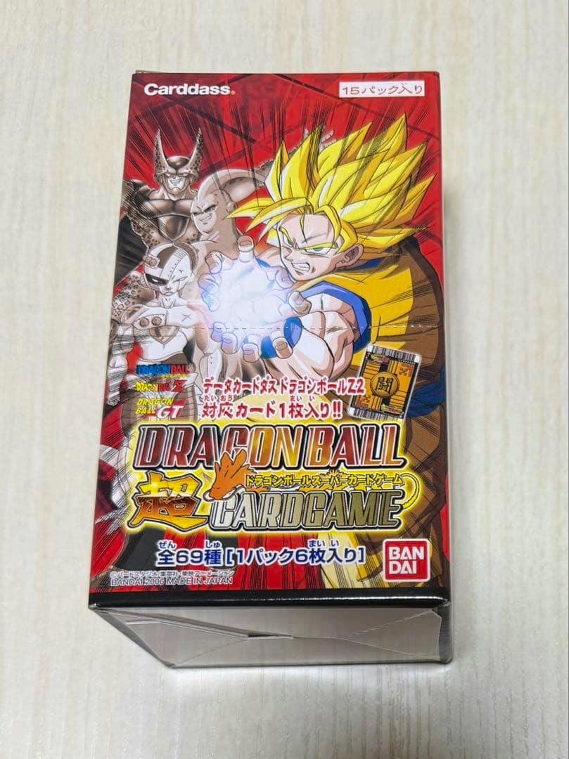 Front view of an unopened Dragon Ball Super card game box showing character artwork and the Bandai logo.
