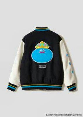 Back view of the DQ+g stadium jumper showing a black body, cream sleeves, and a large blue King Slime graphic.
