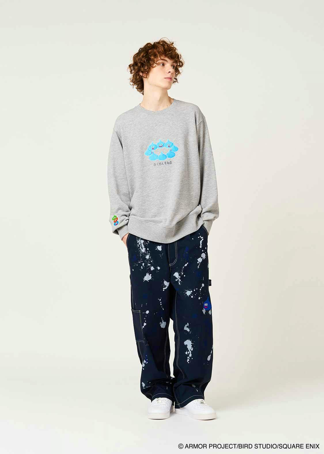Model wearing a grey cotton sweatshirt with a blue Dragon Quest slimes graphic on the chest.