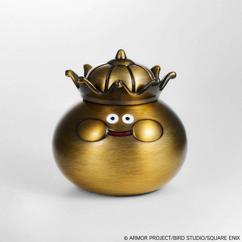 Gold-bronze metallic King Slime collectible figure from Dragon Quest, shown front-facing with its crown.