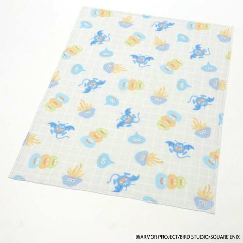 Single-size polyester Dragon Quest blanket laid flat showing a repeating pattern of slime and other monsters.