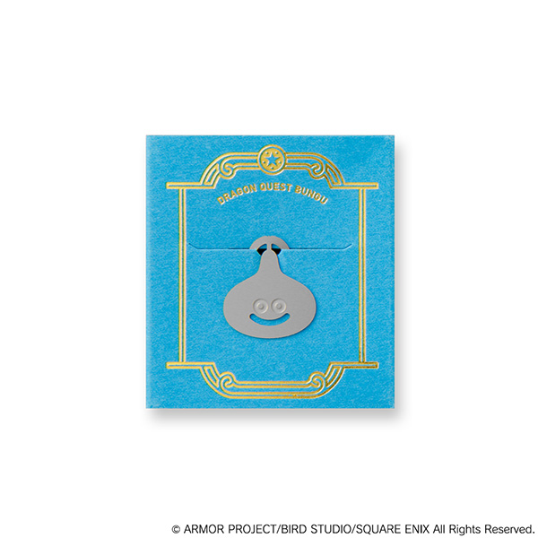 Silver metal paper clip shaped like a Slime character mounted on a blue decorative backing card.