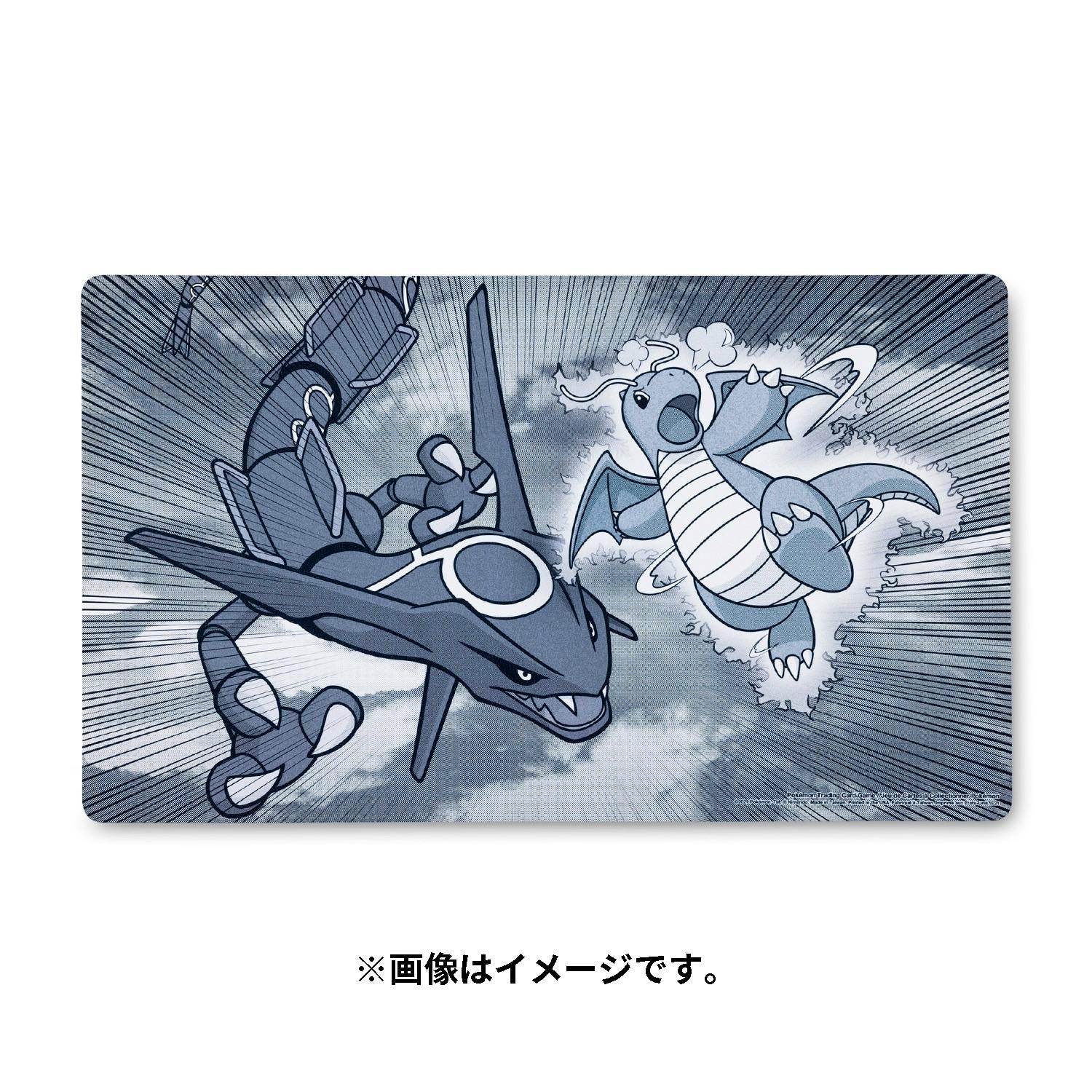 Playmat featuring Rayquaza and Dragonite colliding in a manga-style action illustration.