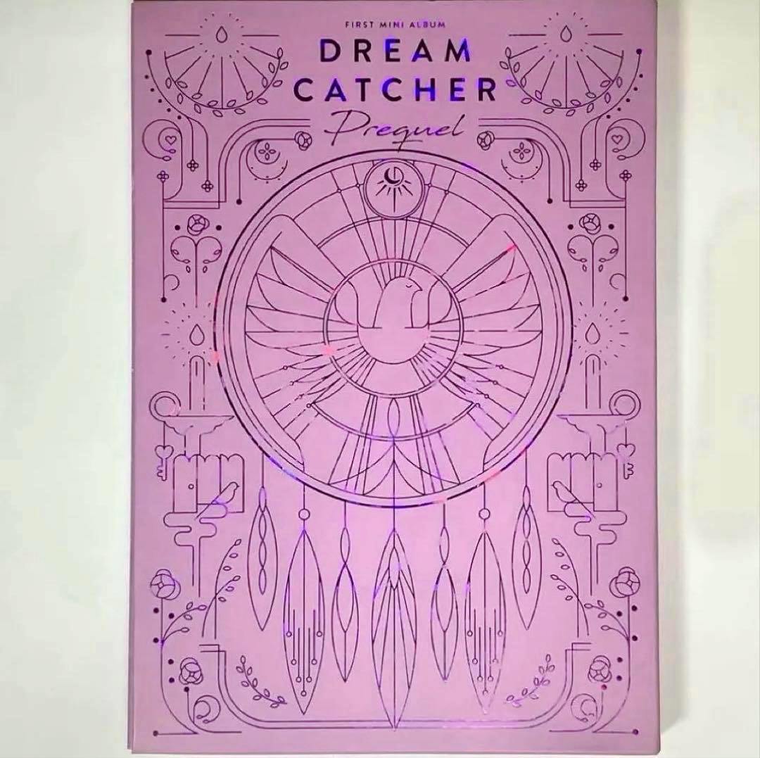Pink album cover of Dream Catcher "Prequel" showing a stylized dreamcatcher illustration and the title.