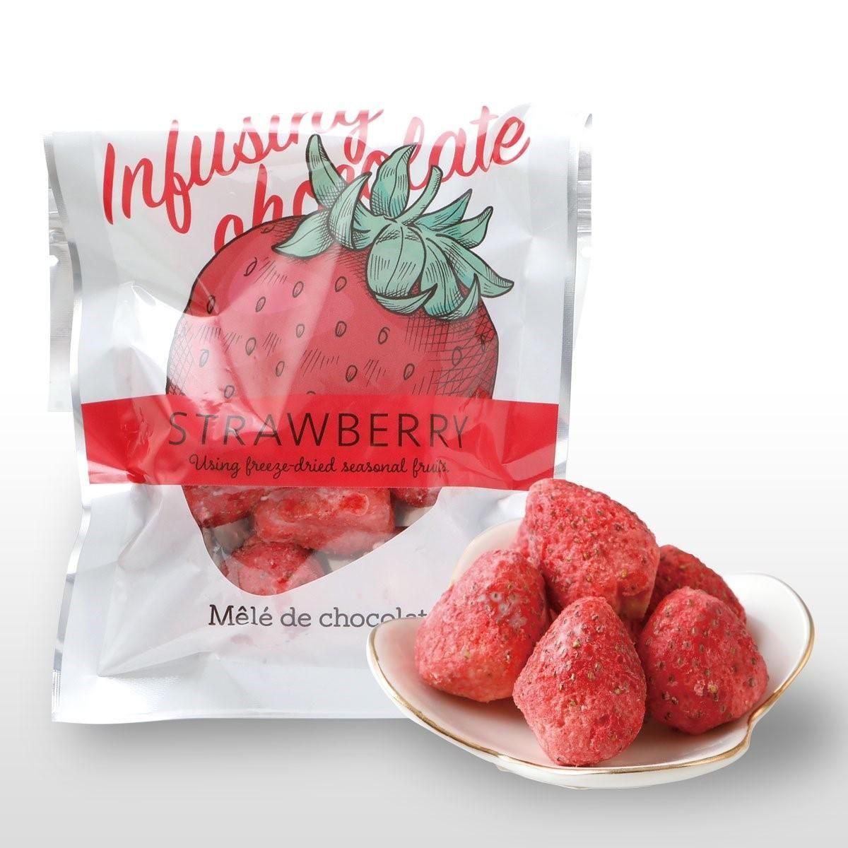 A package labeled "STRAWBERRY" displayed behind a small plate of dried strawberry pieces.