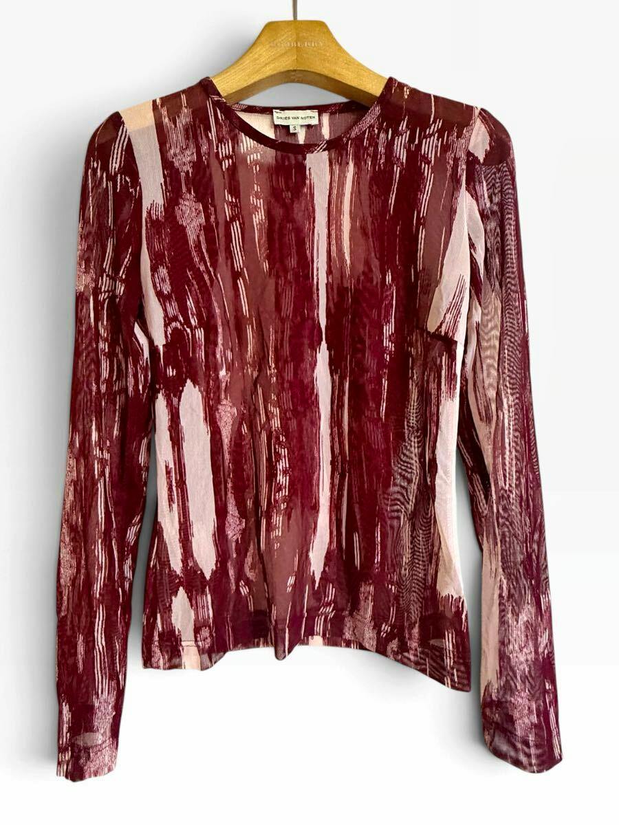 Red patterned long-sleeve mesh women's top by DRIES VAN NOTEN displayed on a hanger.