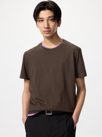 Male model wearing a brown crew-neck T-shirt with a visible contrast inner neckline.