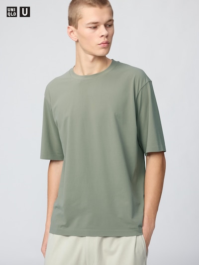A model wearing the Dry EX crew neck T-shirt in green.
