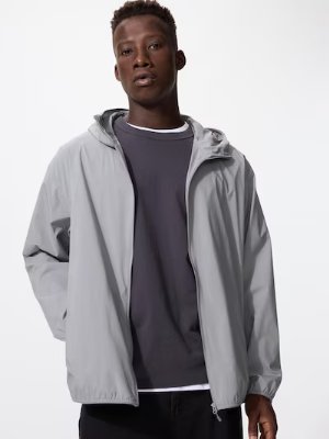 Male model wearing a light gray full-zip hooded men's polyester jacket.