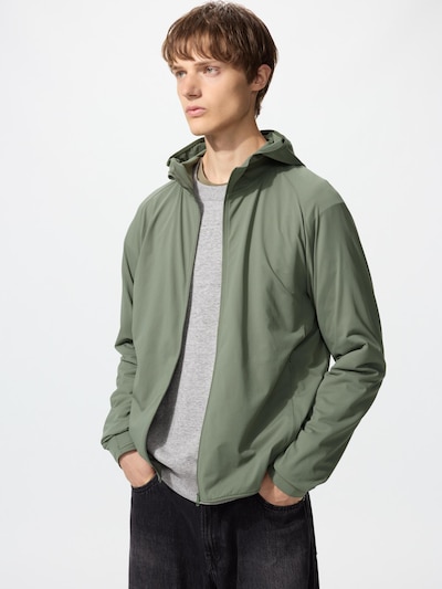 Male model wearing a green men's full-zip hooded polyester jacket.