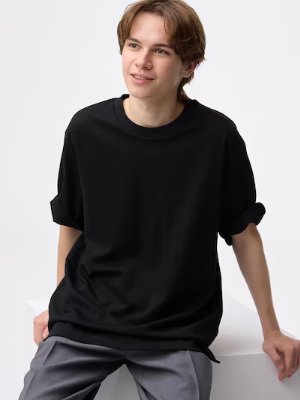 Model wearing the black polyester T-shirt (5-minute sleeve) seated against a white background.