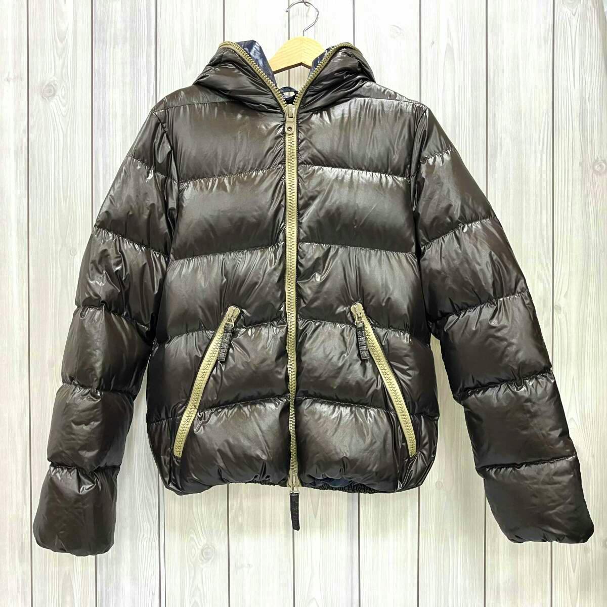 Brown DUVETICA men's nylon down jacket with hood, central zipper, and two front zip pockets hanging on a wooden hanger.