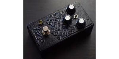 Top view of an EarthQuaker Devices Plumes guitar effects pedal in Nambu ironware finish showing three control knobs, a footswitch, and an input jack.