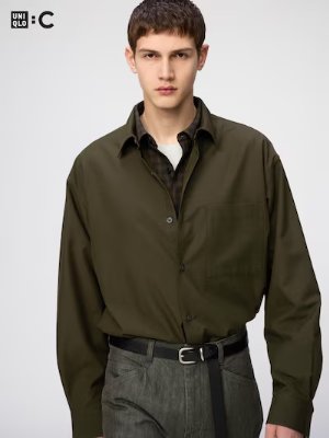 Front view of a men's rayon easy-care soft shirt in olive worn by a model.