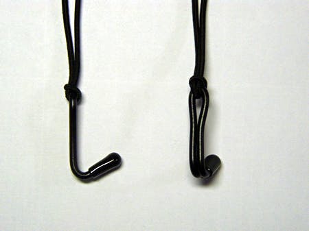Two black nose-hook pieces with attached cords laid on a white background.