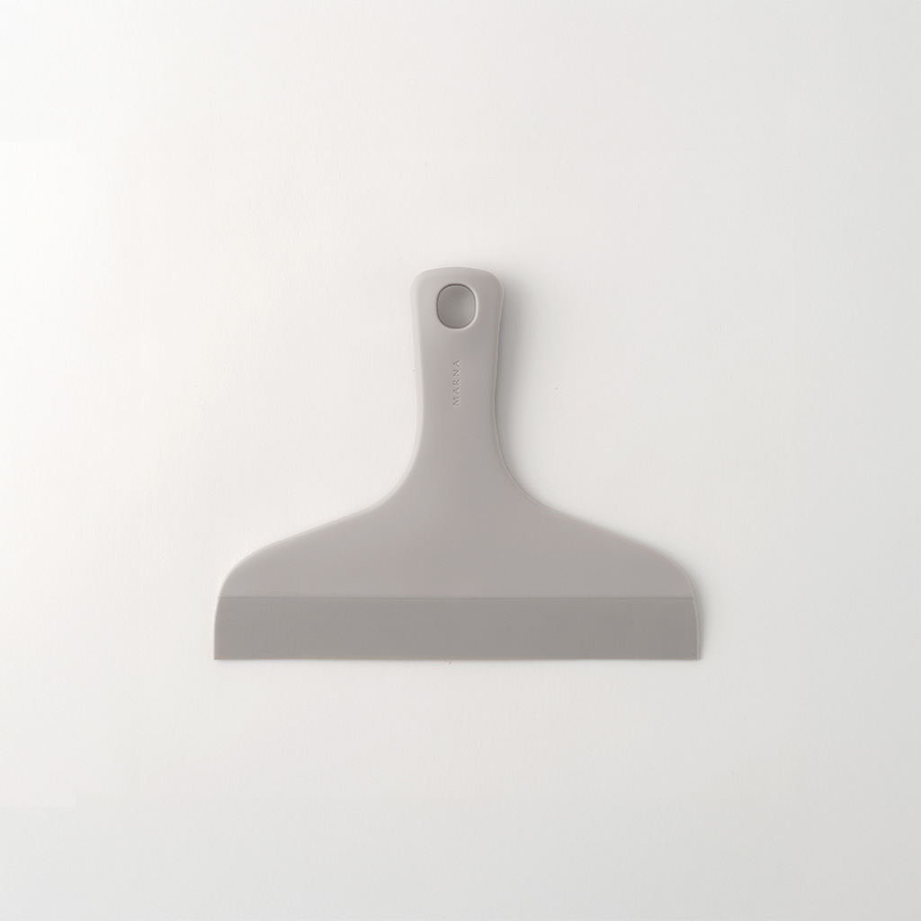 Grey plastic squeegee spatula with a short handle and a hanging hole, shown on a white background.
